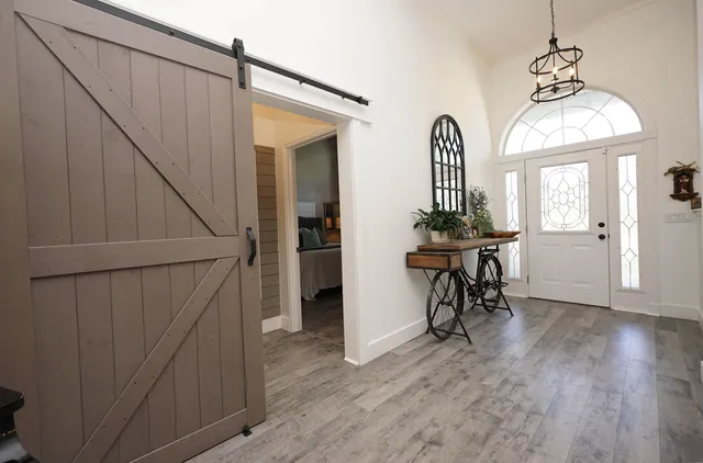a view of a livingroom with furniture and a fireplace