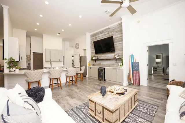 a living room with fireplace furniture and a flat screen tv