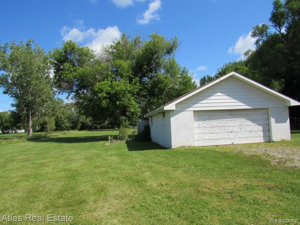 4267 East Bristol Road Burton, MI 48519 - Photo 3 of 10 garage and backyard.jpg
