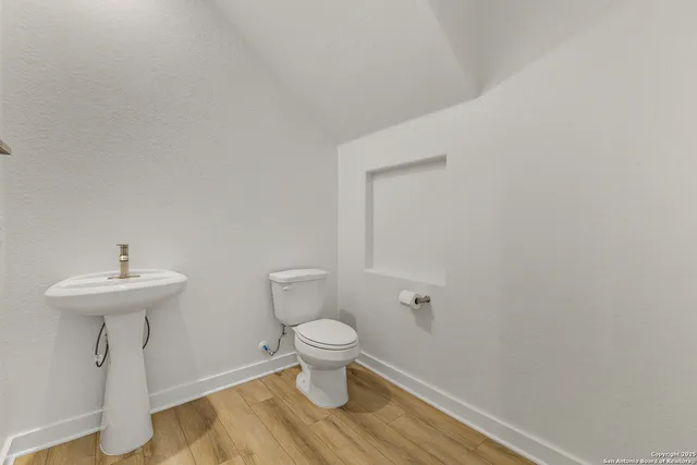 a bathroom with a sink and toilet