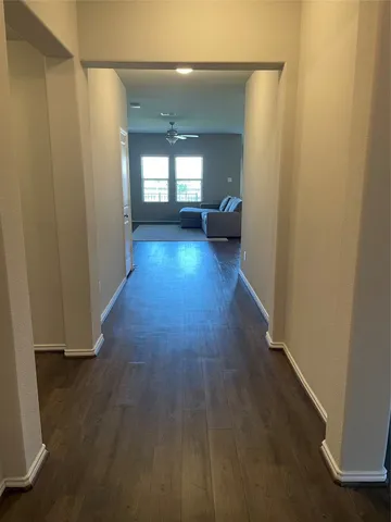 a view of gallery with wooden floor