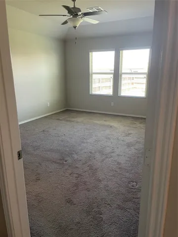 a view of an empty room and window