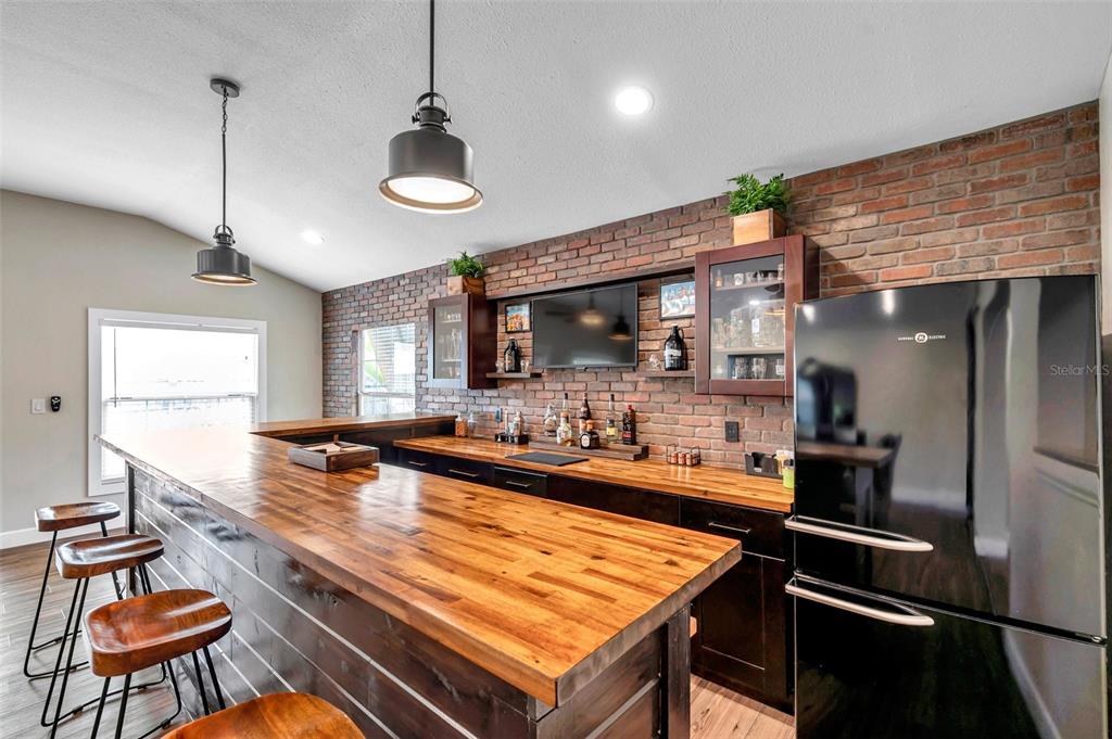 4815 Plantation Drive Tampa, FL 33615 - Photo 15 of 43 a kitchen with stainless steel appliances a stove a refrigerator and a table