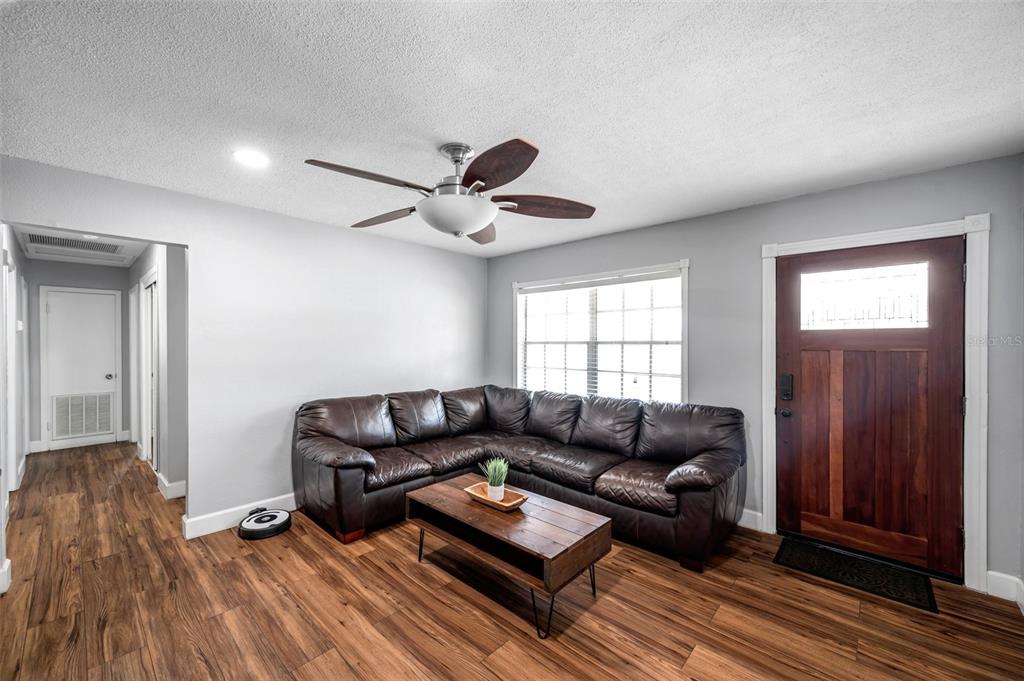 4815 Plantation Drive Tampa, FL 33615 - Photo 16 of 43 a living room with furniture and a wooden floor