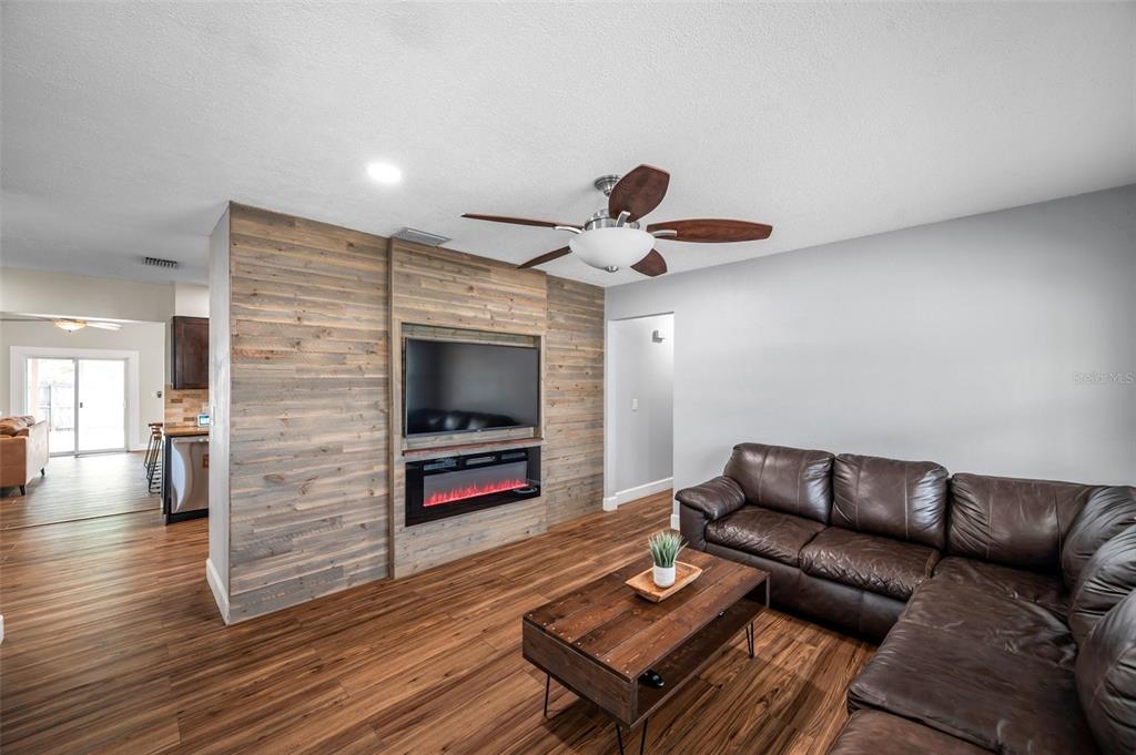 4815 Plantation Drive Tampa, FL 33615 - Photo 17 of 43 a living room with furniture and a flat screen tv