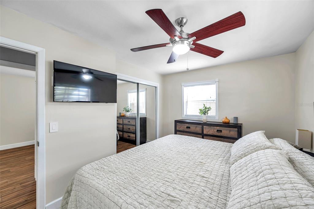 4815 Plantation Drive Tampa, FL 33615 - Photo 20 of 43 a bedroom with a bed and a flat screen tv
