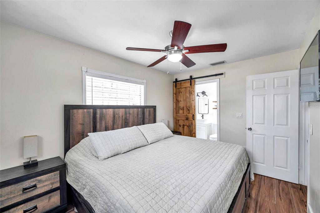 4815 Plantation Drive Tampa, FL 33615 - Photo 21 of 43 a bedroom with a bed and a window