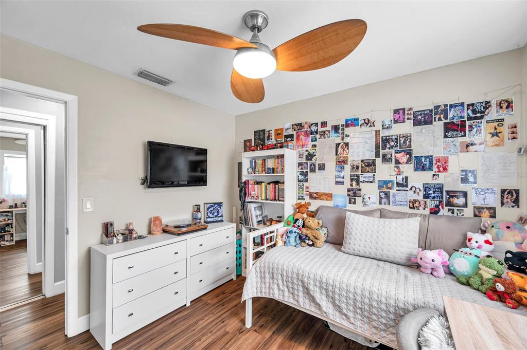 4815 Plantation Drive Tampa, FL 33615 - Photo 26 of 43 a bedroom with a bed and flat screen tv