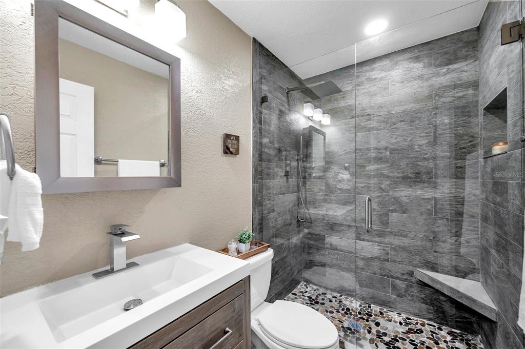 4815 Plantation Drive Tampa, FL 33615 - Photo 27 of 43 a bathroom with a sink toilet and shower