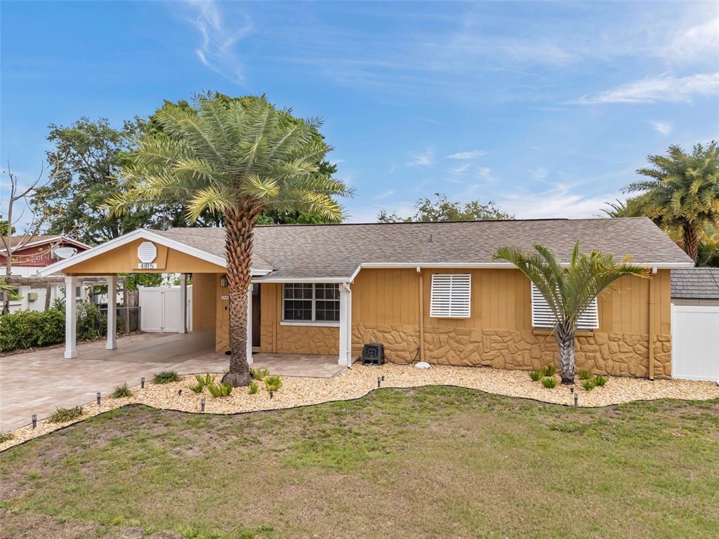 4815 Plantation Drive Tampa, FL 33615 - Photo 3 of 43 a front view of a house with a yard
