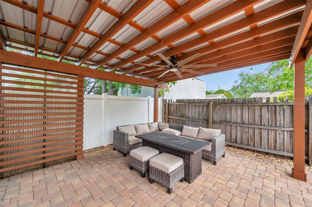 4815 Plantation Drive Tampa, FL 33615 - Photo 32 of 43 a view of patio with a table and chairs