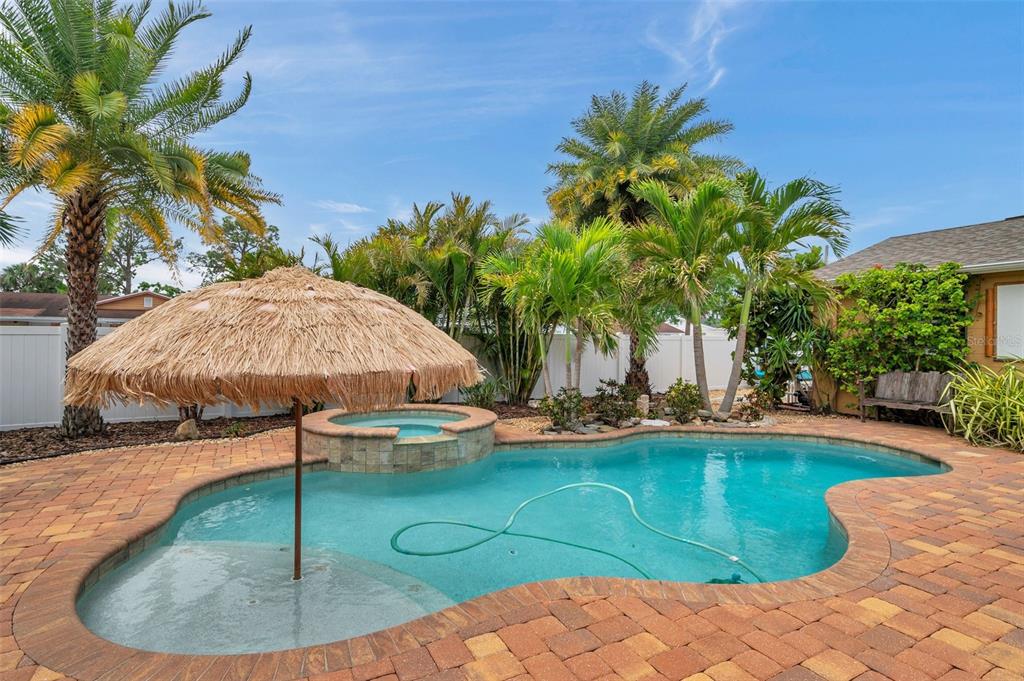 4815 Plantation Drive Tampa, FL 33615 - Photo 35 of 43 a swimming pool with an outdoor space and seating area