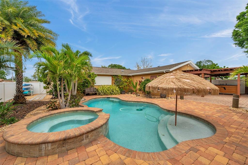 4815 Plantation Drive Tampa, FL 33615 - Photo 36 of 43 a view of a swimming pool with a yard