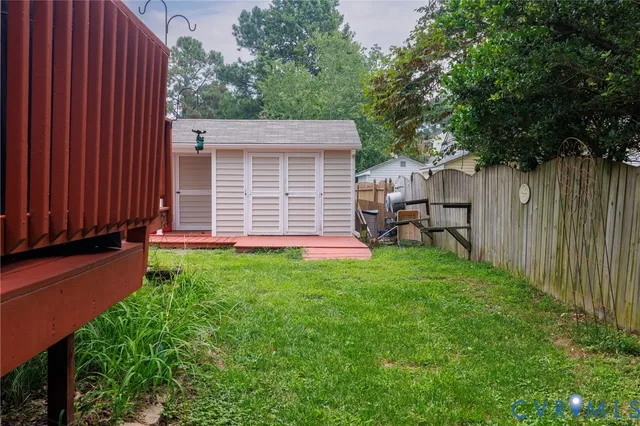 a view of a backyard with a large tree