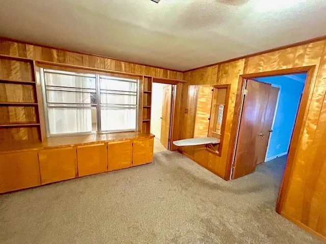 a view of kitchen with sink microwave and refrigerator