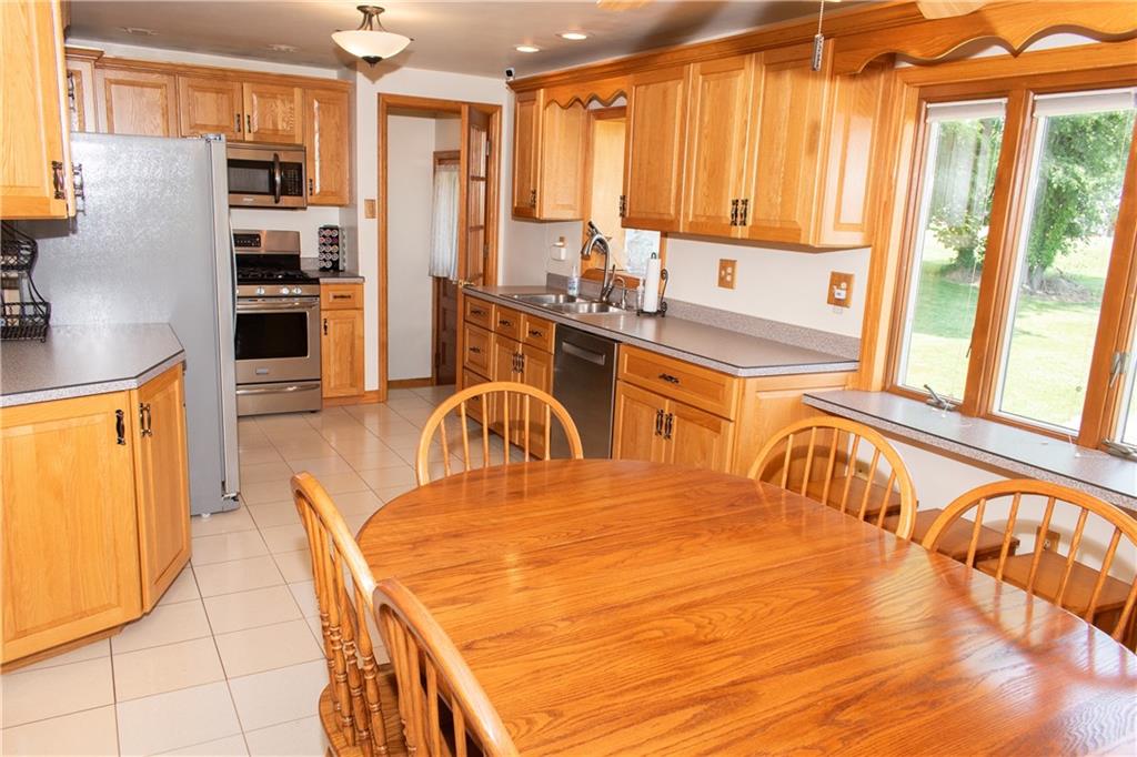 3124 Main Street Aliquippa, PA 15001 - Photo 14 of 30 a kitchen with stainless steel appliances granite countertop a refrigerator a stove and a sink with granite countertops