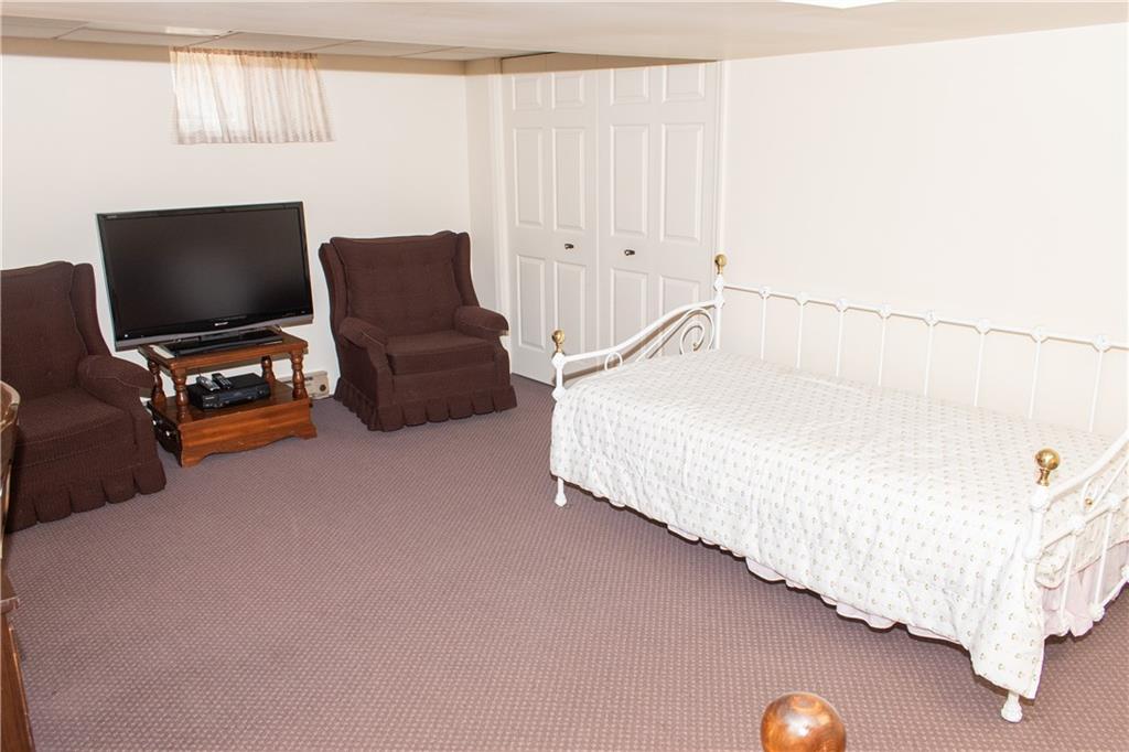 3124 Main Street Aliquippa, PA 15001 - Photo 26 of 30 a bedroom with bed and a flat tv screen