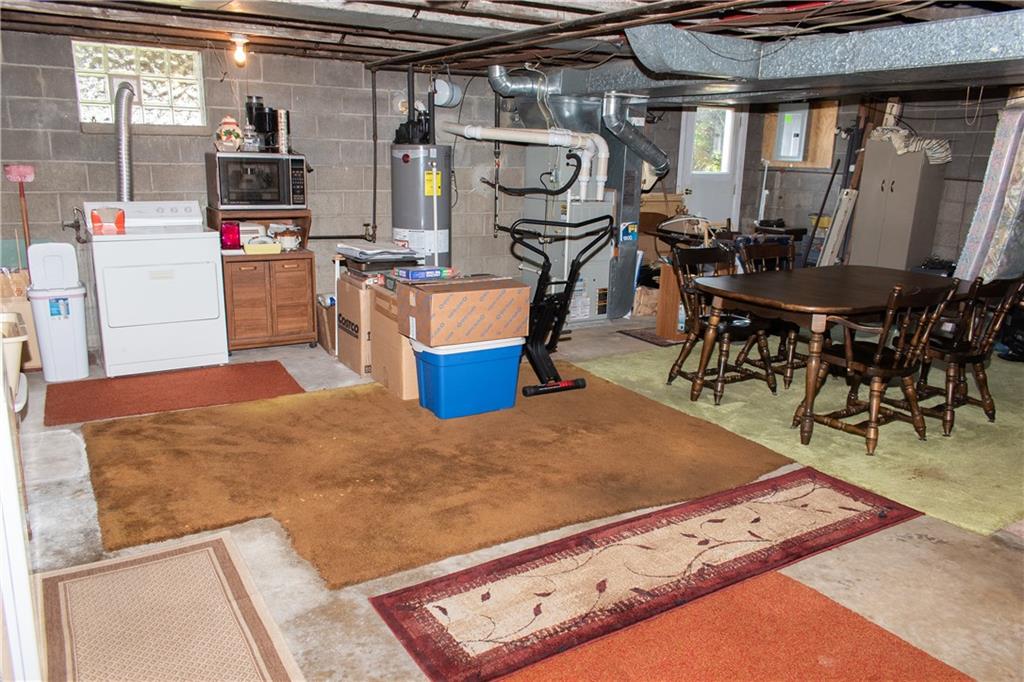 3124 Main Street Aliquippa, PA 15001 - Photo 29 of 30 a living room with stainless steel appliances kitchen island granite countertop a stove and a refrigerator