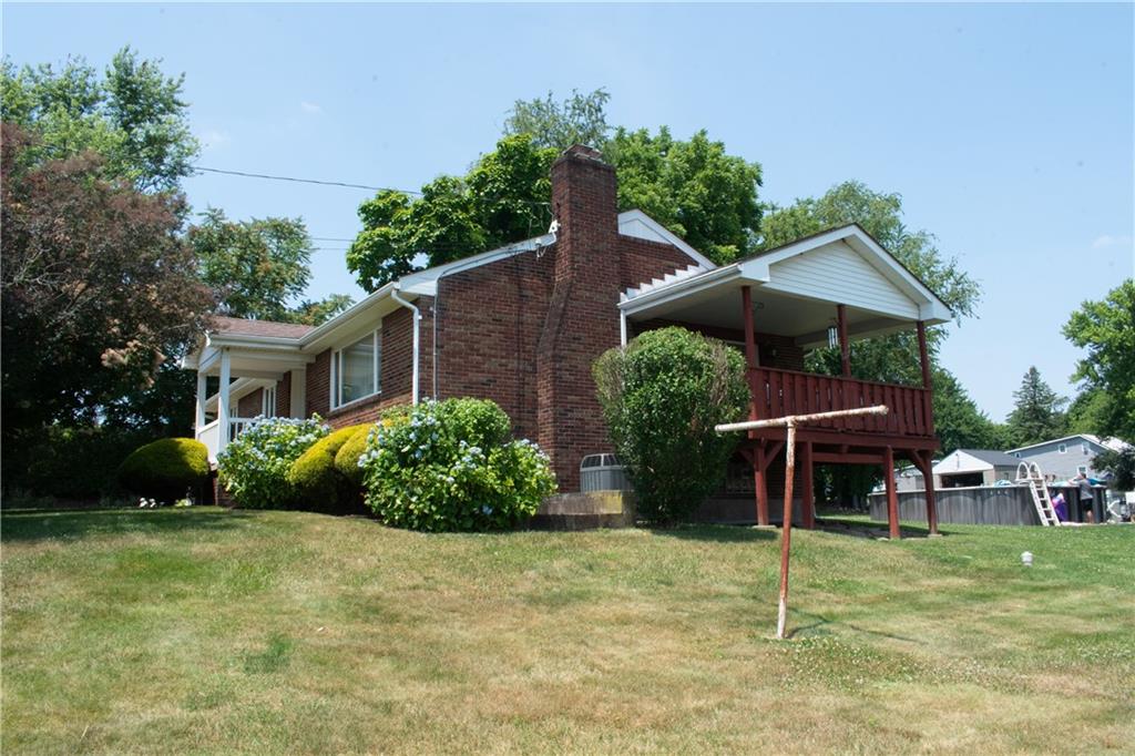 3124 Main Street Aliquippa, PA 15001 - Photo 3 of 30 a front view of a house with a yard and potted plants