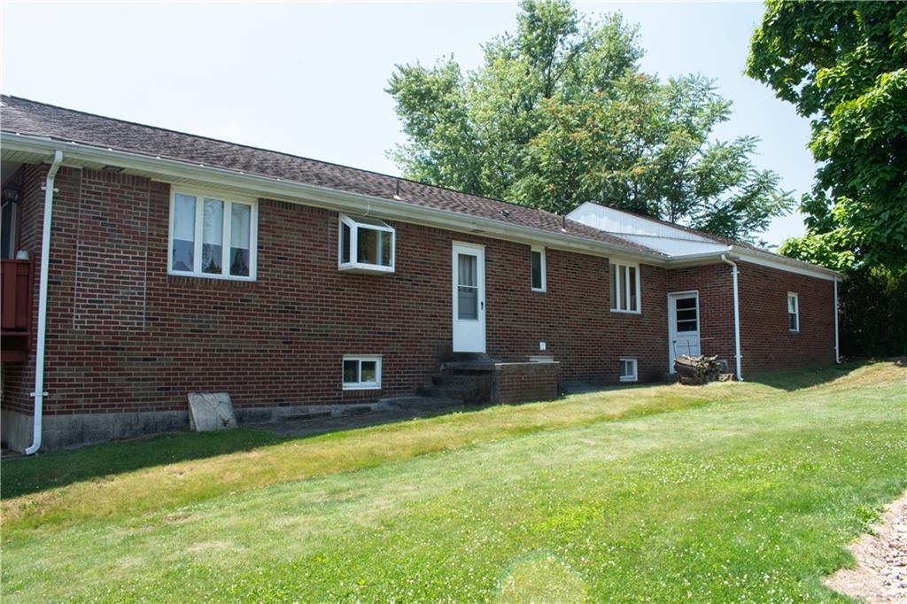 3124 Main Street Aliquippa, PA 15001 - Photo 4 of 30 a brick house with a yard