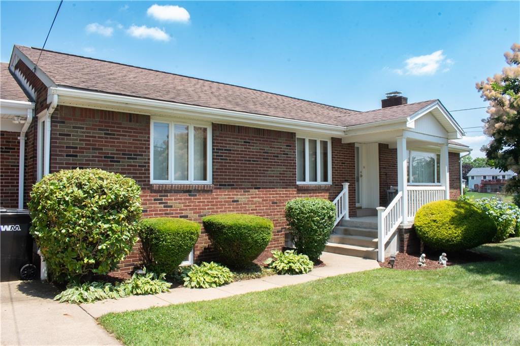 3124 Main Street Aliquippa, PA 15001 - Photo 6 of 30 a front view of a house with a yard and potted plants