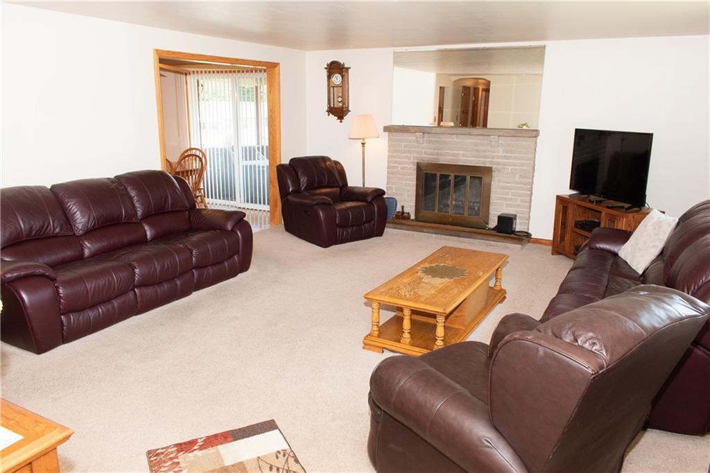 3124 Main Street Aliquippa, PA 15001 - Photo 7 of 30 a living room with furniture a flat screen tv and a fireplace