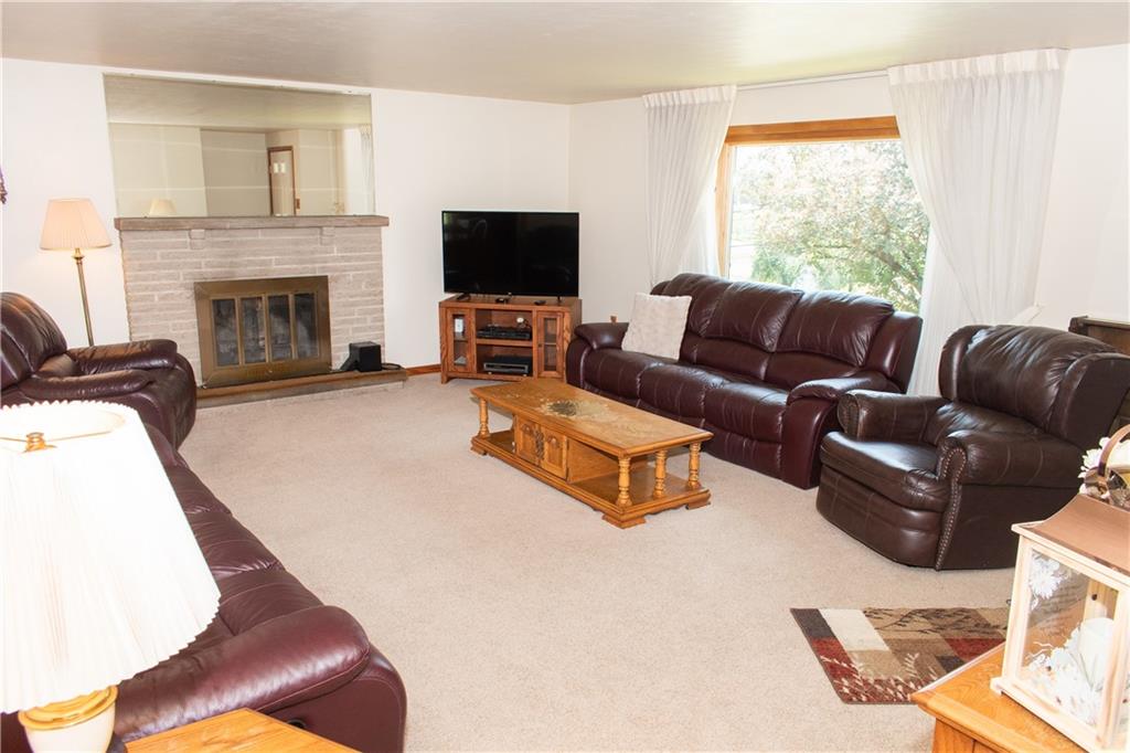 3124 Main Street Aliquippa, PA 15001 - Photo 10 of 30 a living room with furniture a flat screen tv and a fireplace
