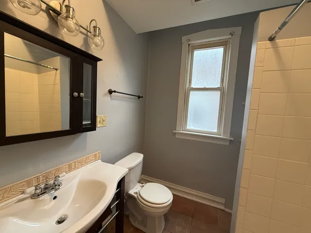 a bathroom with a sink and a toilet