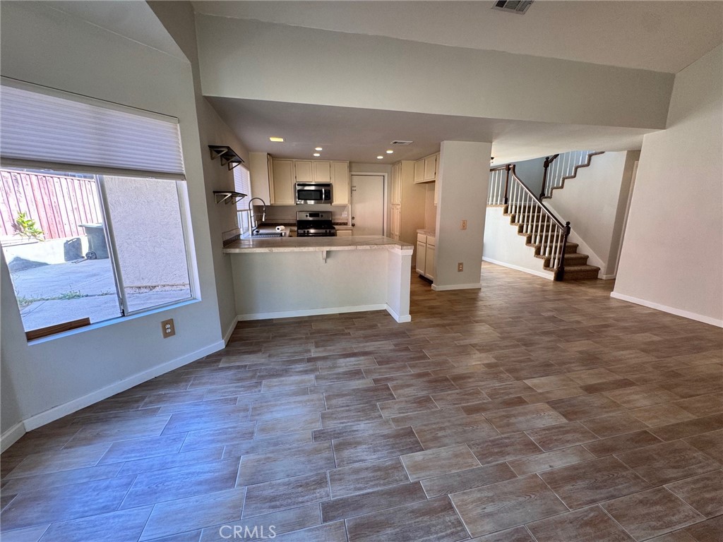 30628 Moontide Court Temecula, CA 92592 - Photo 14 of 53 a large kitchen with a sink and refrigerator