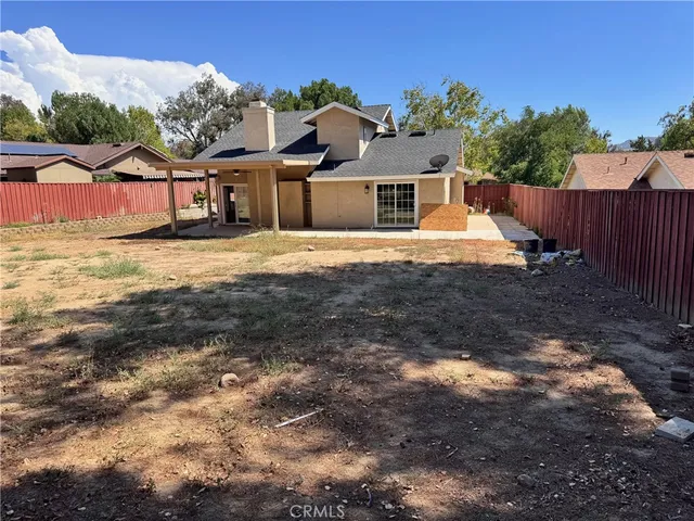 a view of a backyard of the house