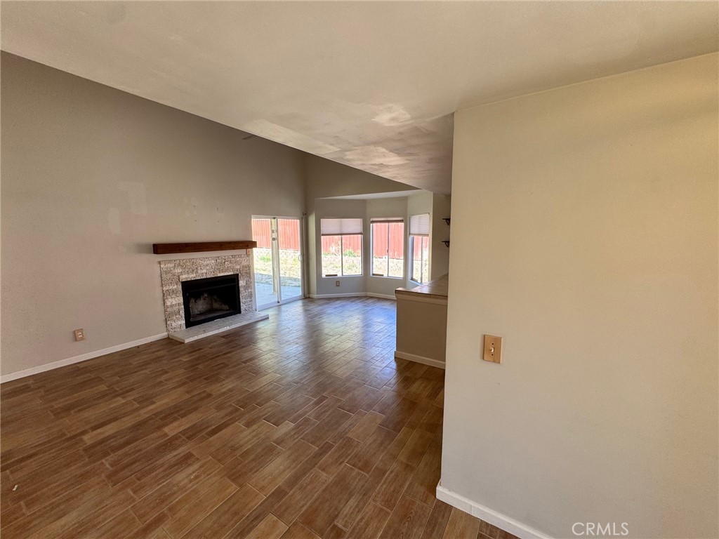 30628 Moontide Court Temecula, CA 92592 - Photo 6 of 53 a view of an empty room with window and wooden floor