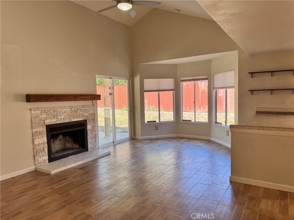 30628 Moontide Court Temecula, CA 92592 - Photo 53 of 53 a big room with wooden floor a fireplace and windows