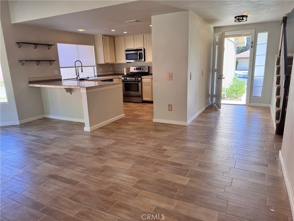 30628 Moontide Court Temecula, CA 92592 - Photo 9 of 53 a kitchen with stainless steel appliances granite countertop a refrigerator a stove top oven a sink and dishwasher