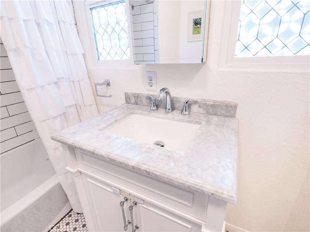 4290 Oakwood Place Riverside, CA 92506 - Photo 19 of 41 a bathroom with a sink and a mirror