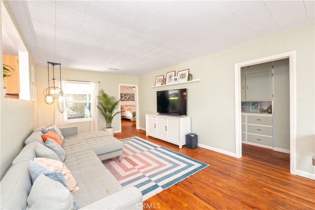 4290 Oakwood Place Riverside, CA 92506 - Photo 2 of 41 a living room with furniture and a flat screen tv