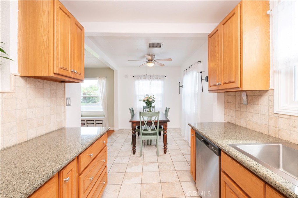 4290 Oakwood Place Riverside, CA 92506 - Photo 5 of 41 a kitchen with a sink a counter top space and appliances