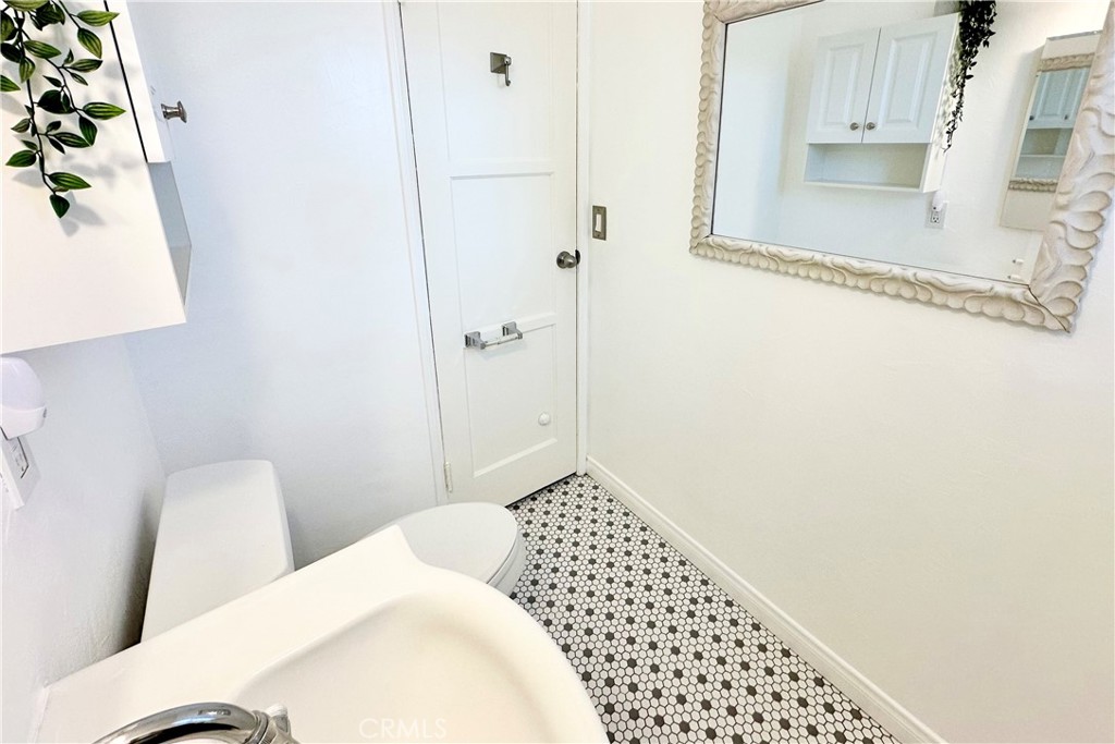 4290 Oakwood Place Riverside, CA 92506 - Photo 10 of 41 a bedroom with a bed and a white wall