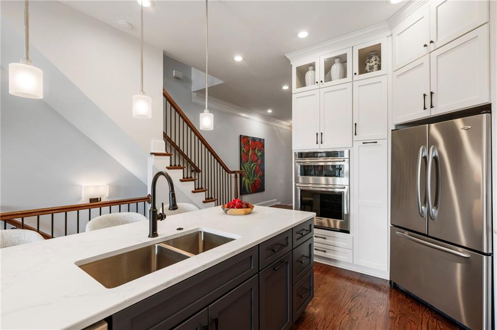 3611 Habersham Road Northwest Atlanta, GA 30305 - Photo 11 of 44 a kitchen with stainless steel appliances a sink and a refrigerator
