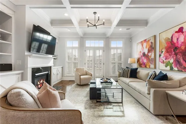 a living room with furniture fireplace and flat screen tv