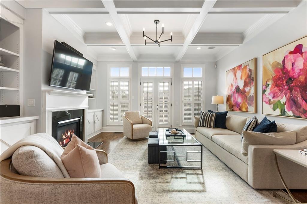 3611 Habersham Road Northwest Atlanta, GA 30305 - Photo 16 of 44 a living room with furniture fireplace and flat screen tv