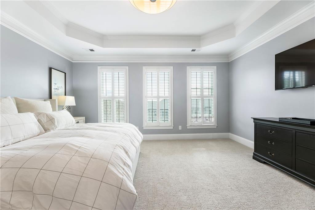 3611 Habersham Road Northwest Atlanta, GA 30305 - Photo 29 of 44 a spacious bedroom with a bed and a television