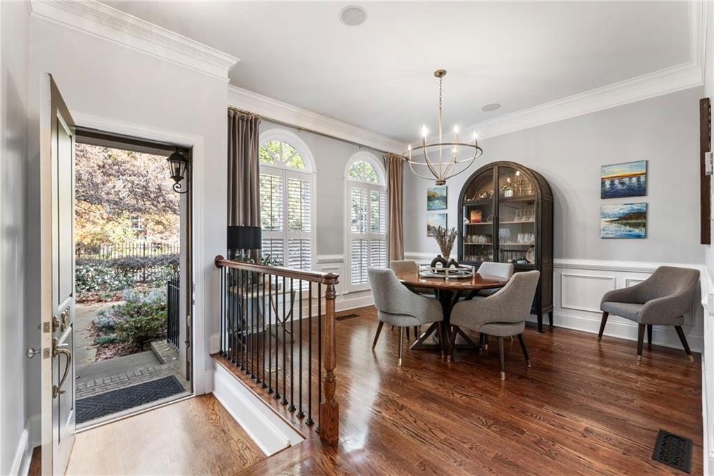 3611 Habersham Road Northwest Atlanta, GA 30305 - Photo 3 of 44 a view of a dining room with furniture window and wooden floor