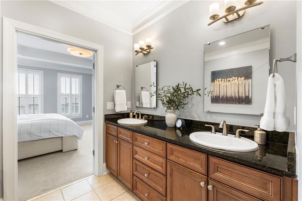 3611 Habersham Road Northwest Atlanta, GA 30305 - Photo 31 of 44 a en suite bathroom with double sink and a mirror
