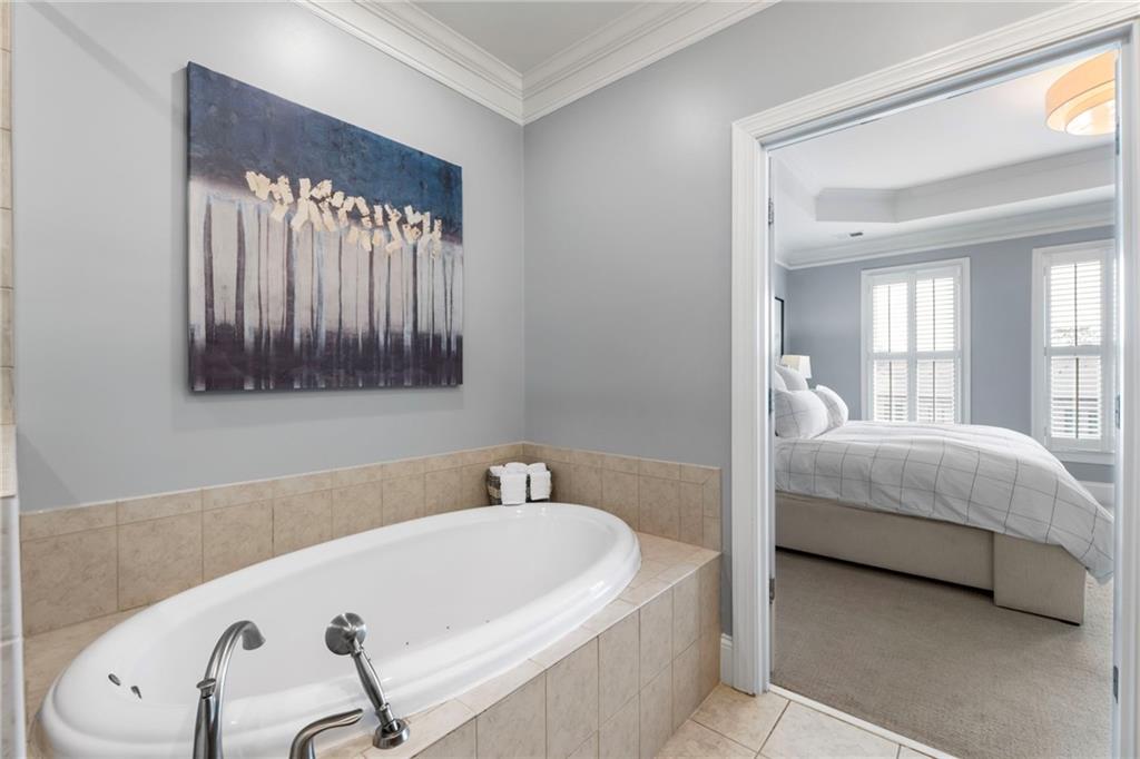 3611 Habersham Road Northwest Atlanta, GA 30305 - Photo 33 of 44 a bathroom with a bathtub and a sink