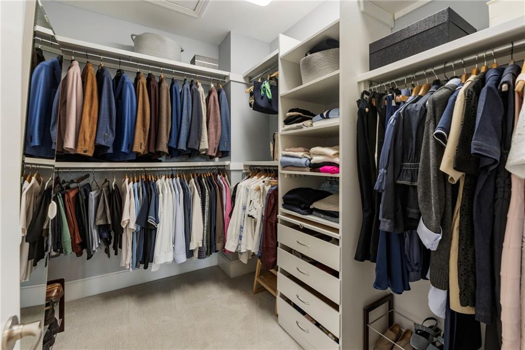 3611 Habersham Road Northwest Atlanta, GA 30305 - Photo 35 of 44 a view of walk in closet with clothes and shoes