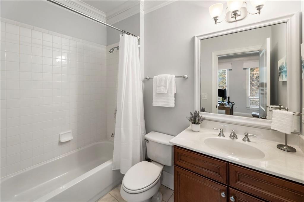 3611 Habersham Road Northwest Atlanta, GA 30305 - Photo 37 of 44 a bathroom with a sink a toilet and shower