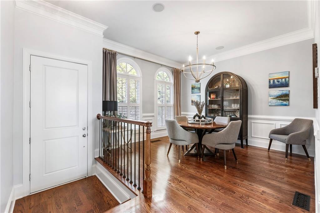 3611 Habersham Road Northwest Atlanta, GA 30305 - Photo 4 of 44 a view of a dining room with furniture window and wooden floor