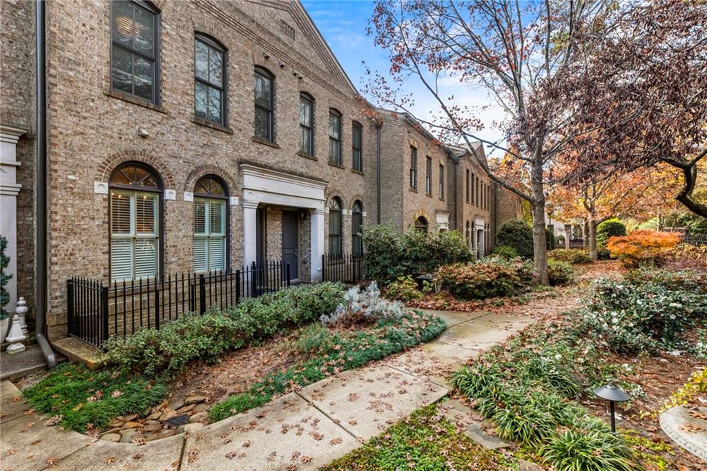 3611 Habersham Road Northwest Atlanta, GA 30305 - Photo 43 of 44 a front view of a house with garden and plants
