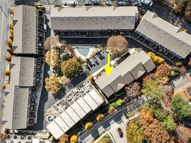 an aerial view of a house with a garden and fire pit