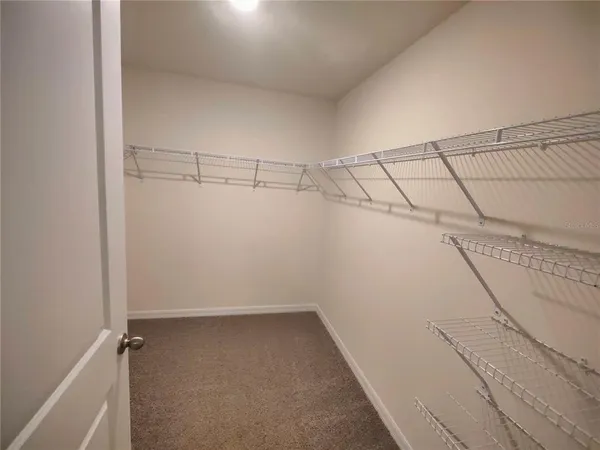 a view of a room with racks on the wall